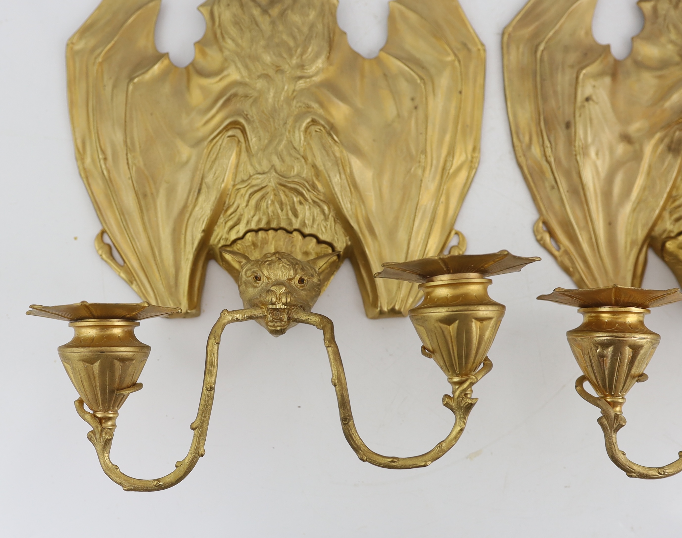 After William Tonks & Sons for Liberty & Co. of London, a pair of Victorian ormolu wall brackets modelled as hanging bats